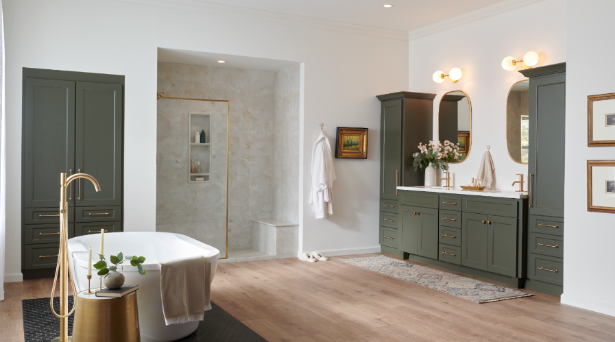 a bathroom with green cabinets and two sinks