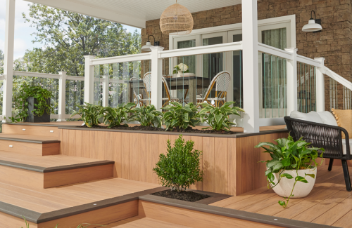 a porch with a table and chairs on it